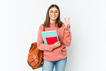 Young student woman isolated on white bakcground showing number two with fingers.