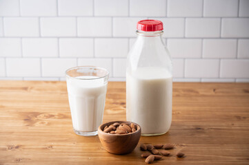 almond milk image on wooden background