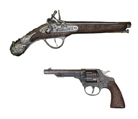 There are a flintlock pistol and a revolver. White background. Isolated.