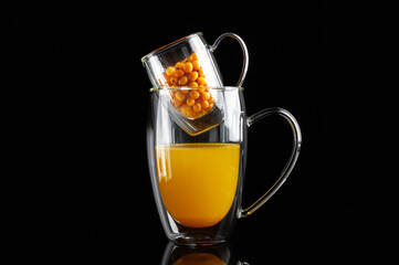  medicinal sea buckthorn tea on a black background
