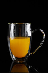 medicinal sea buckthorn tea on a black background