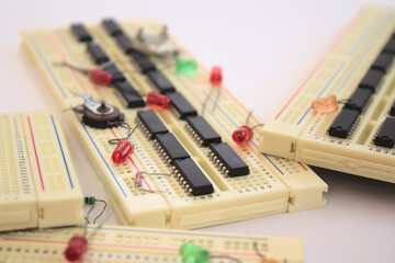 Selective focus. Different micro electronics tools such as proto board, leds, and circuits for...