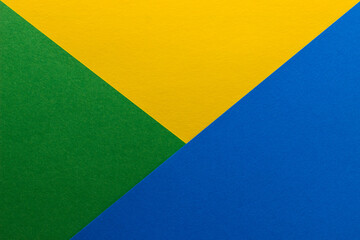 Beautiful multicolored background of yellow, green and blue blank paper sheets with fine texture,...