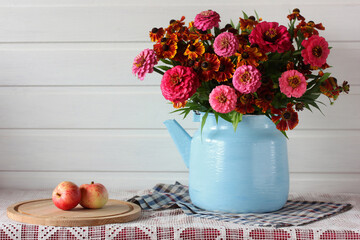 Obraz na płótnie Canvas bouquet of garden flowers and apples.