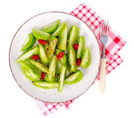 Appetizer of spicy pickled green tomatoes