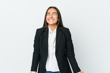 Obraz premium Young asian bussines woman isolated on white background laughs and closes eyes, feels relaxed and happy.
