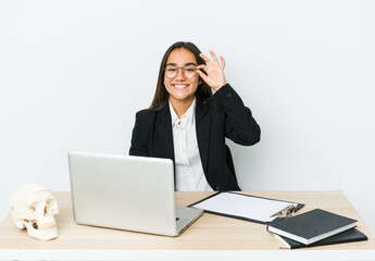 Young traumatologist asian woman isolated on white background excited keeping ok gesture on eye.