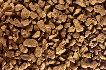 Instant, dark, dry freeze-dried coffee close-up. Food background