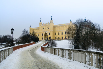 Snowy path to the castle of Lublin in winter - obrazy, fototapety, plakaty