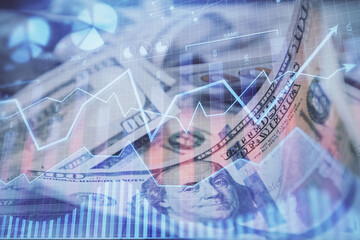 Double exposure of forex graph drawing over us dollars bill background. Concept of financial markets.