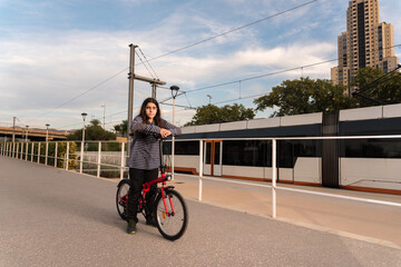 Teenage boy with long hair or girl at the train station