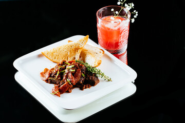 beef goulash on a black background