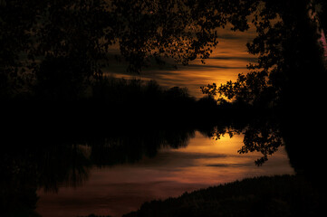 Fototapeta premium sunset over the river