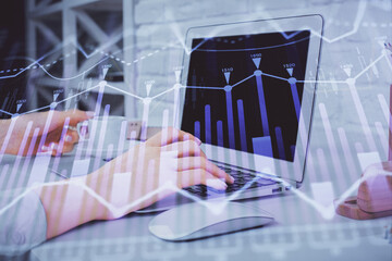 Double exposure of woman hands typing on computer and forex chart hologram drawing. Stock market analysis concept.