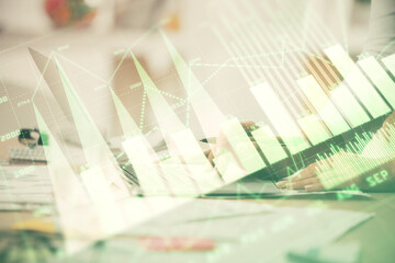 Double exposure of woman hands typing on computer and forex chart hologram drawing. Stock market invest concept.