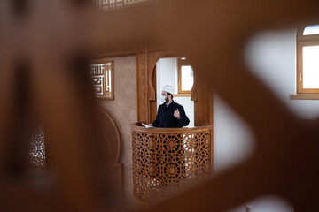 Muslims religious leader Imam or emam has a speech on friday afternoon prayer in a mosque during...