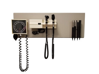 Photo of a device that doctors use, usually attached to the wall, that measures blood pressure, and checks both eyes and ears.  Its been clipped and added to white background.