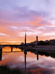 Colorful sunset with the clouds over the city