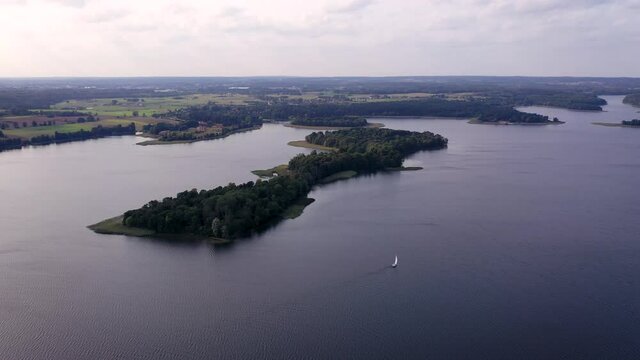 4K drone view of Narie lake in Kretowiny village in Ilawa Lake District, in Warmia Mazury region of Poland