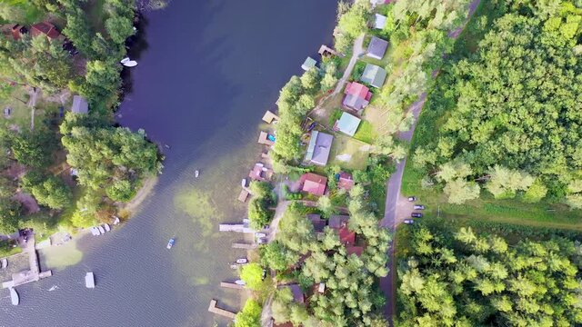 Summer houses over Narie lake in Kretowiny village, Warmia Mazury region of Poland - 4k footage