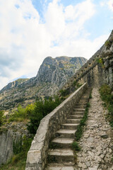 Fototapeta na wymiar The old serpentine stone steps leading up to the top of St John's fortress (Sveti Ivan or San Giovanni) in Kotor, Montenegro