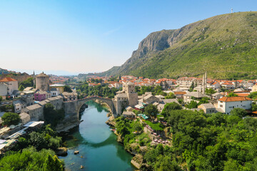 Fototapeta na wymiar Beautiful view of Mostar's old bridge and the Neretva river as seen from the minaret of Koskin-Mehmed Pasha's Mosque