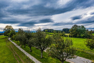 Obraz premium dark clouds over the country road