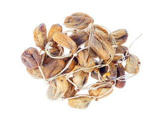 Pile of dried figs on rope isolated on white background. Studio Photo