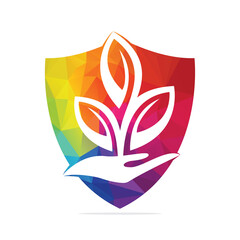 Plant in Hand Vector Logo Design. Natural Products in Shield Shape. Cosmetics and Spa logo.	