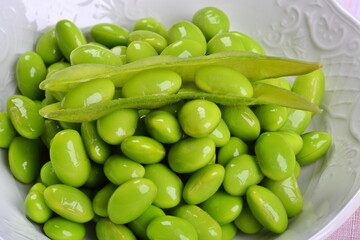 Fresh Green Peas in a White Bowl	