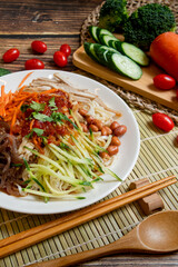 Yunnan-Style Cold Noodles, (cold noodles and vegetables in a sweet, sour, and savory sauce.)
