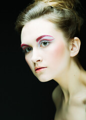 Fototapeta premium young female face with bright fashion multicolored make-up