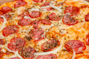 Round pepperoni pizza on a white table