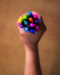 hand holding colorful markers