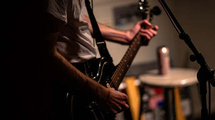 Fototapeta na wymiar Man playing Electric Guitar in a Studio