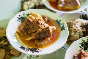 portrait beef gravel food on a plate on in a traditional food dish