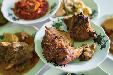 portrait of traditional food on a plate is usually called padang cuisine
