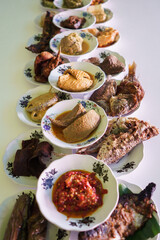 portrait of traditional food on a plate is usually called padang cuisine