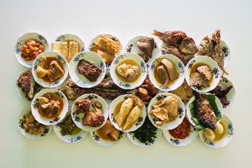 portrait of traditional food on a plate is usually called padang cuisine