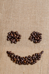 The smile face of coffee beans on hessian sack, Love coffee concept