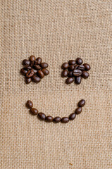 The smile face of coffee beans on hessian sack, Love coffee concept