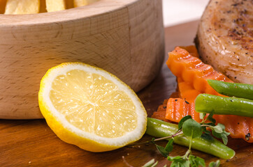 Close-up of fresh organic lemon on wood background.