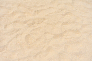 Obraz na płótnie Canvas Top view of nature sand texture, Closeup fine beach sand on the beach, Nature sand texture and background, Nature and background concept.