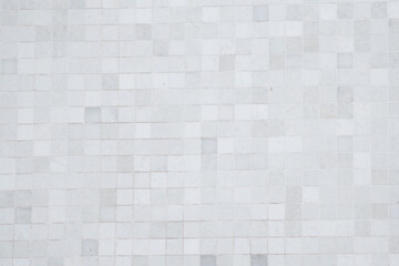 Closeup shot of tile mosaic white and gray pattern background.