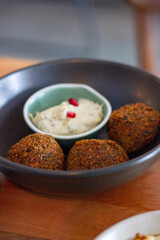 Falafel balls with yogurt and herb sauce