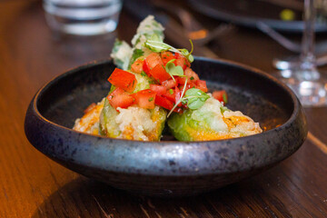 Stuffed zucchini flowers with tomato