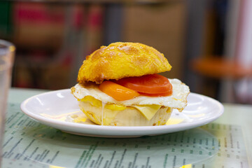 Hong Kong-style breakfast sandwich on pineapple bun