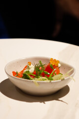 Raw salmon, cream and caviar in bowl