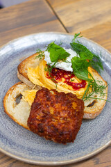 Scrambled chilli eggs on toast with potato rosti