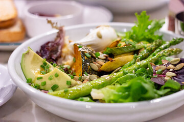 Superfood salad with avocado and poached egg